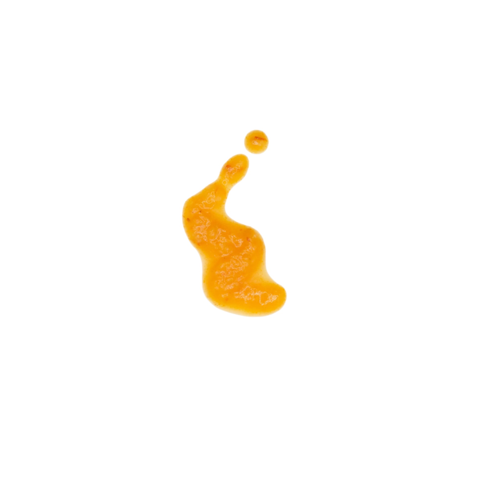 pineapple habanero sauce drip on a white background to demonstrate consistency