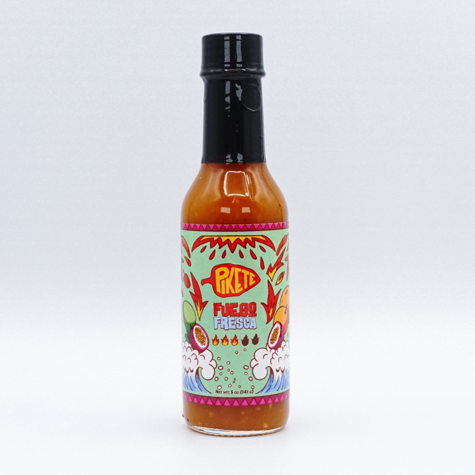 Hot sauce bottle with colorful label on a white background