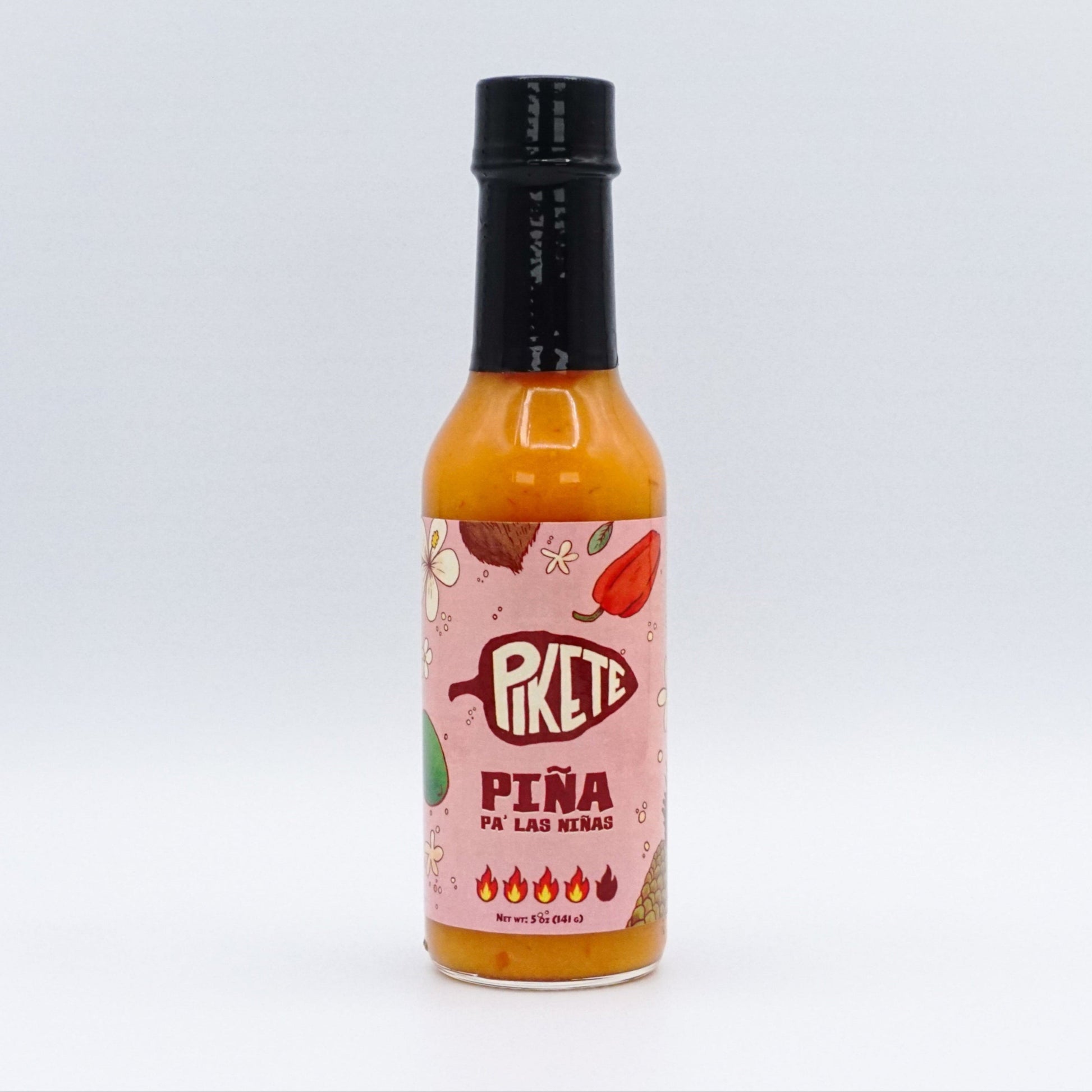 Bottle of Pikete Piña hot sauce on a white background